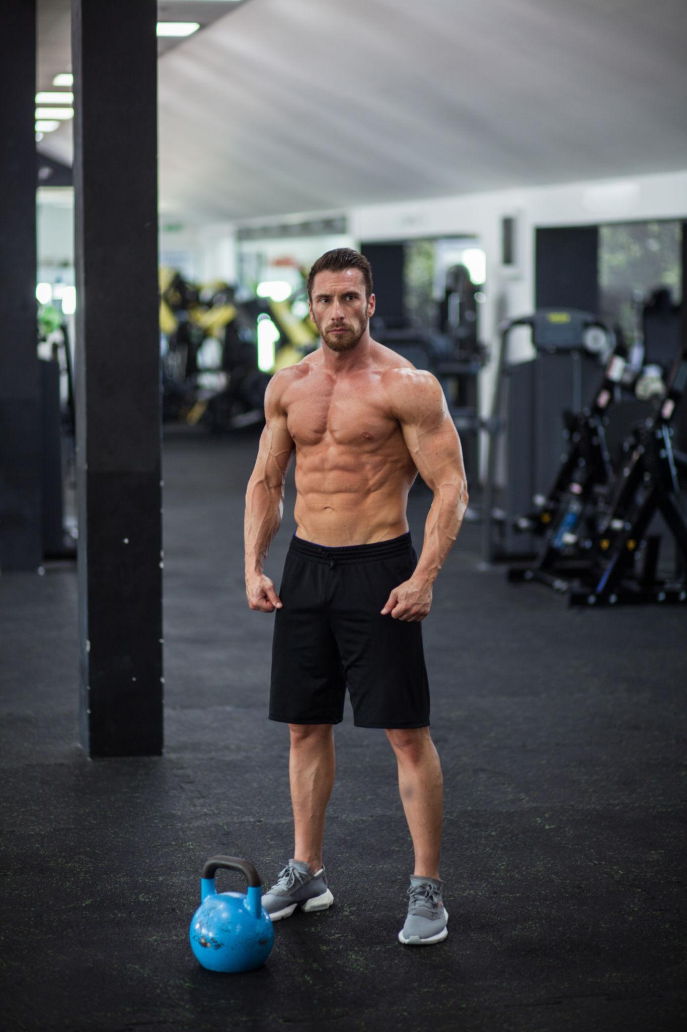 Hands Behind Head Pose - best gym photography poses