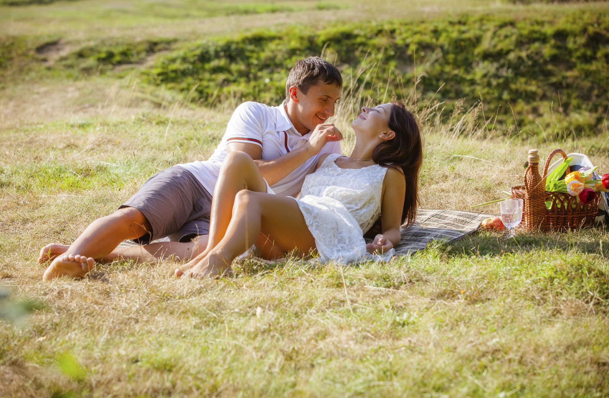 Looking at the ocean together - Romantic couple poses