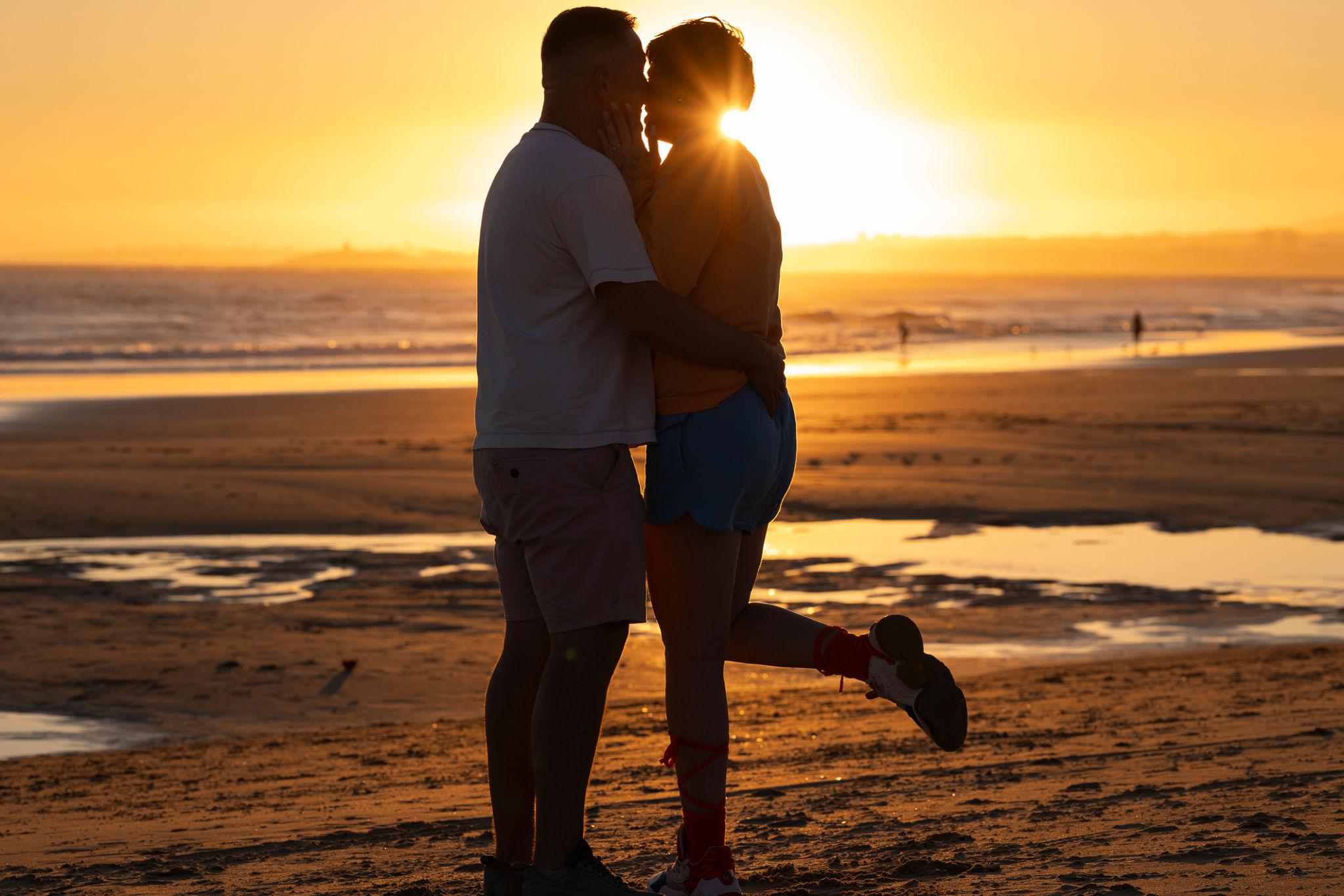 beach couple poses